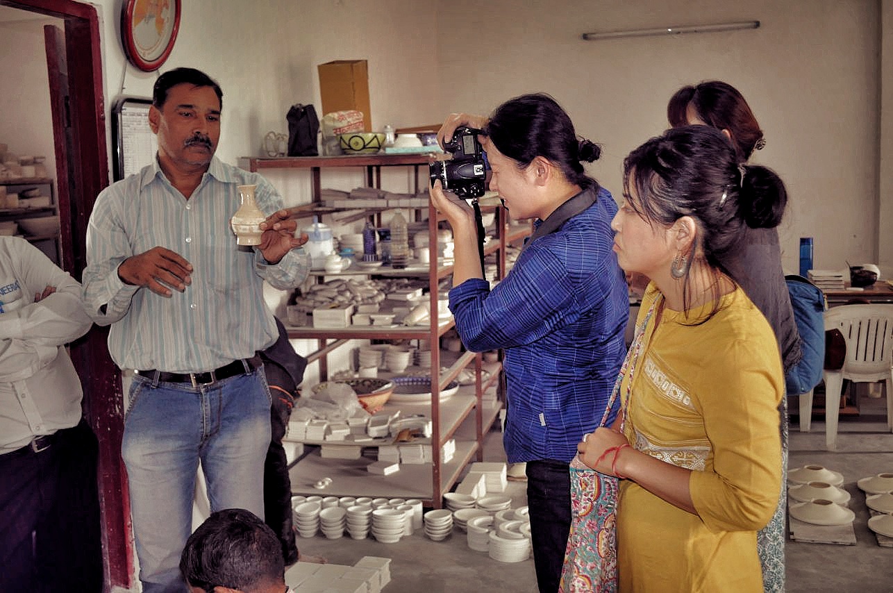 Group understanding making of blue pottery
