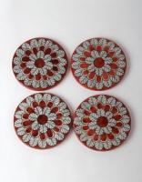 White Leafy Design on Red Coasters
